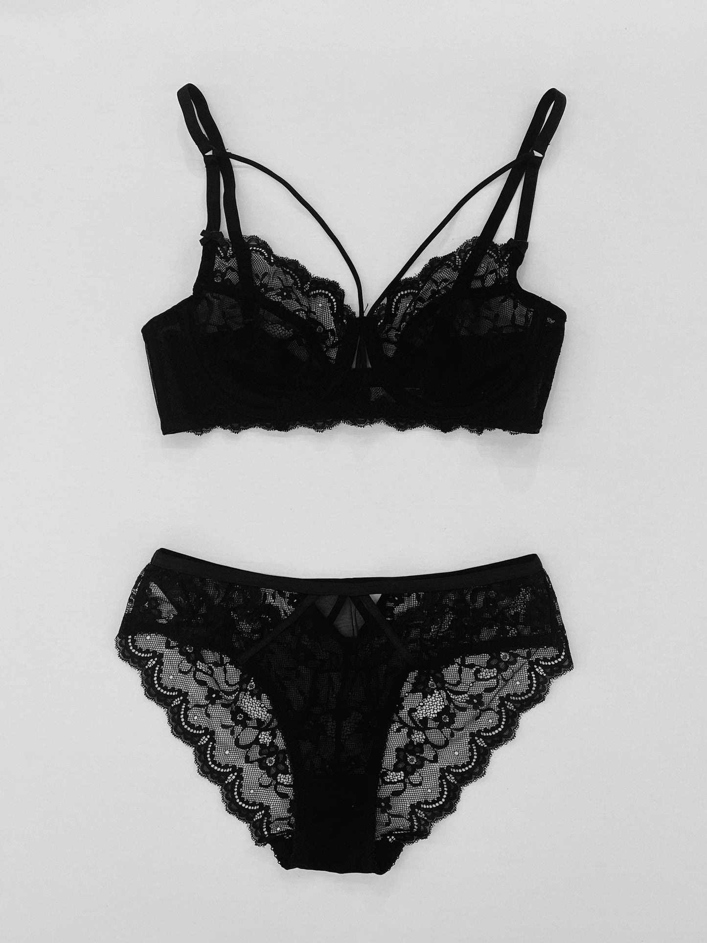 Solid floral lace lingerie set with strappy design for women.