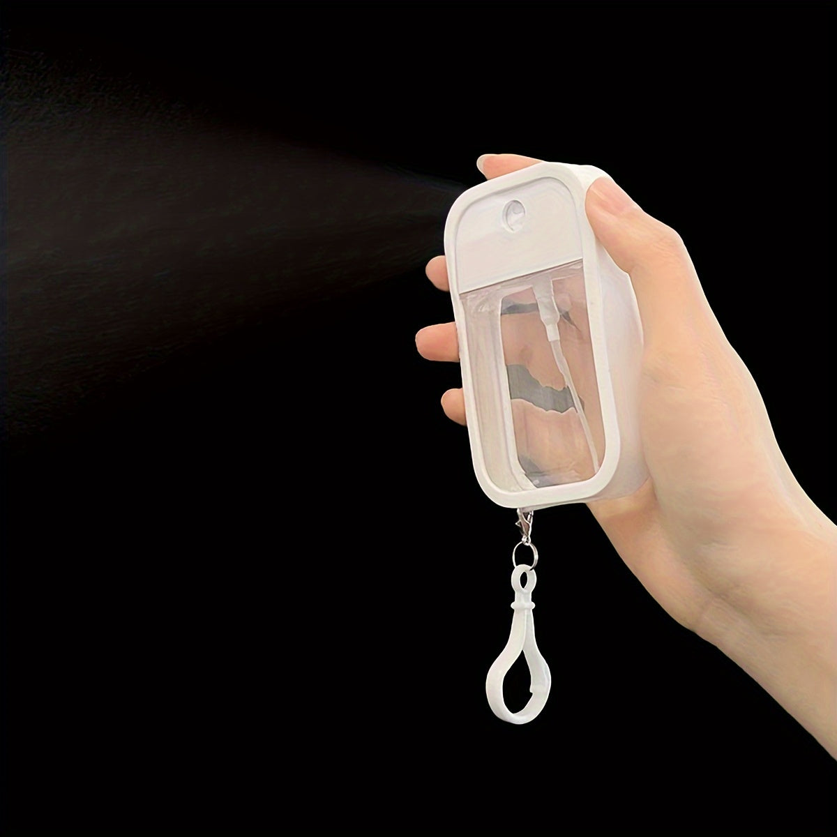 Portable high-pressure spray bottle for alcohol hand sanitizer, perfect for travel with 50ml capacity, ideal as Christmas or Halloween gifts.