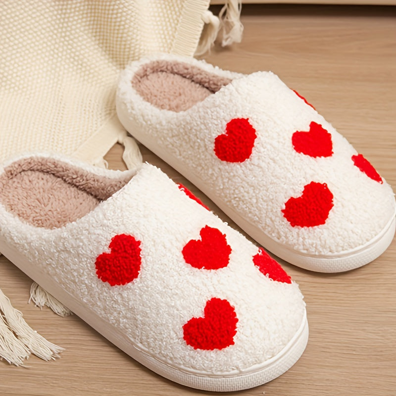 Cozy slip-on slippers with cute heart pattern, plush lining for indoor comfort.