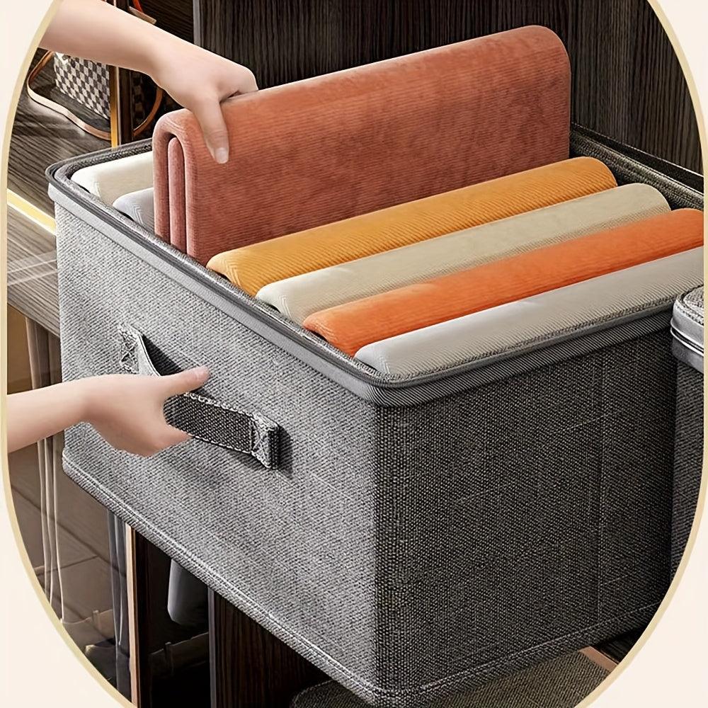 Collapsible storage box with zipper lid and handles, ideal for organizing clothes in the wardrobe.