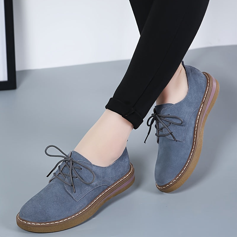 Women's flat, lace-up loafers in solid color, perfect for back to school with a comfortable preppy style.