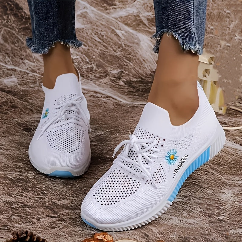 Women's breathable sneakers in chic white and pink with floral embroidery, lightweight and durable for outdoor activities.