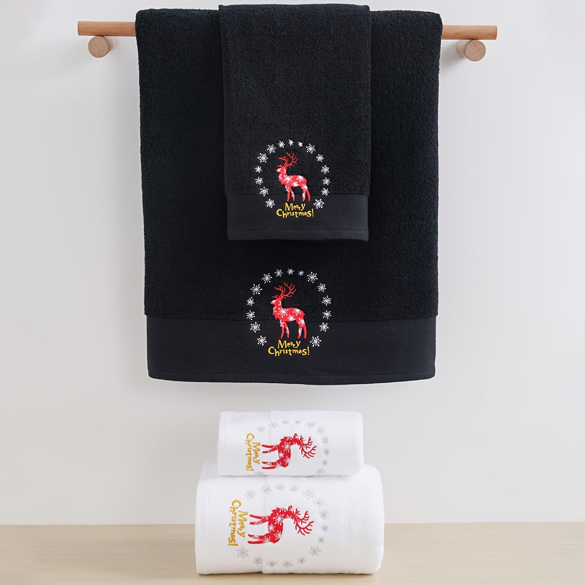 Christmas-themed towel set with embroidered snowman design. Includes 2 towels and 1 bath towel, ideal for couples' bathroom essentials and holiday gifts. Made of 100% cotton.