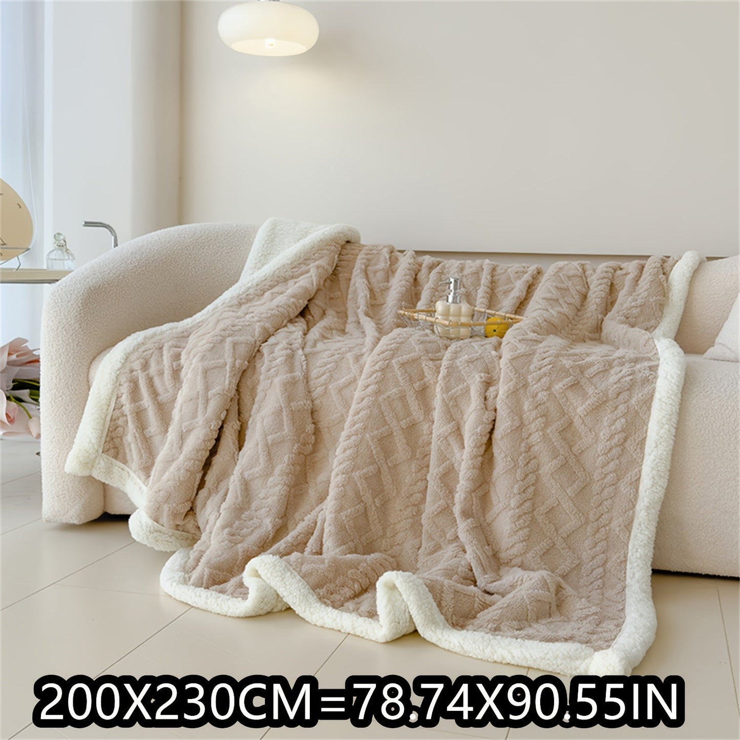 Soft cable-knit fleece blanket in blue, available in 150x200cm or 200x230cm sizes. Featuring a contemporary style, this blanket is machine washable and perfect for use in the bedroom, living room, office, or while camping during the winter. Made with a