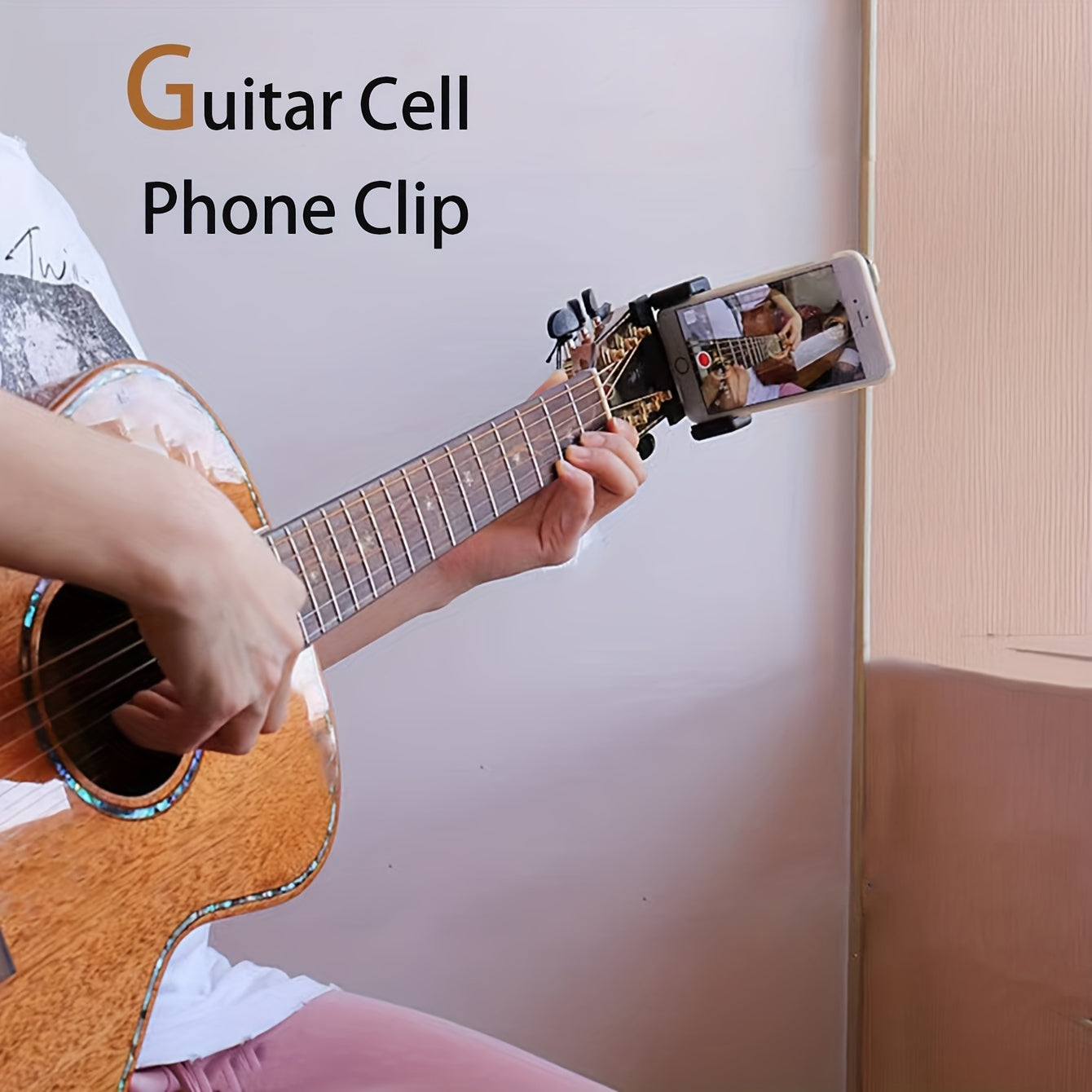 Black alloy cell phone clip for live streaming and recording musical instruments, doubles as a selfie holder.