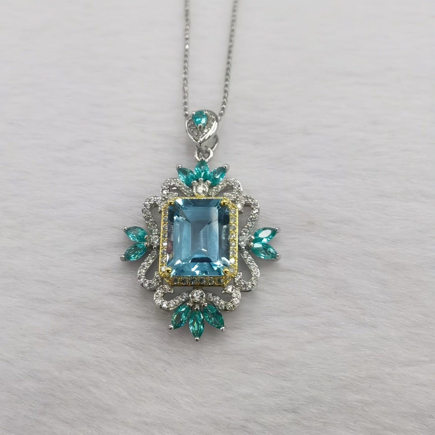 Stylish and lavish 14K gold plated alloy pendant necklace featuring synthetic crystal and imitation topaz, designed in a fashionable European style with high carbon drill rhinestones for women. Perfect for everyday wear and as a gift.