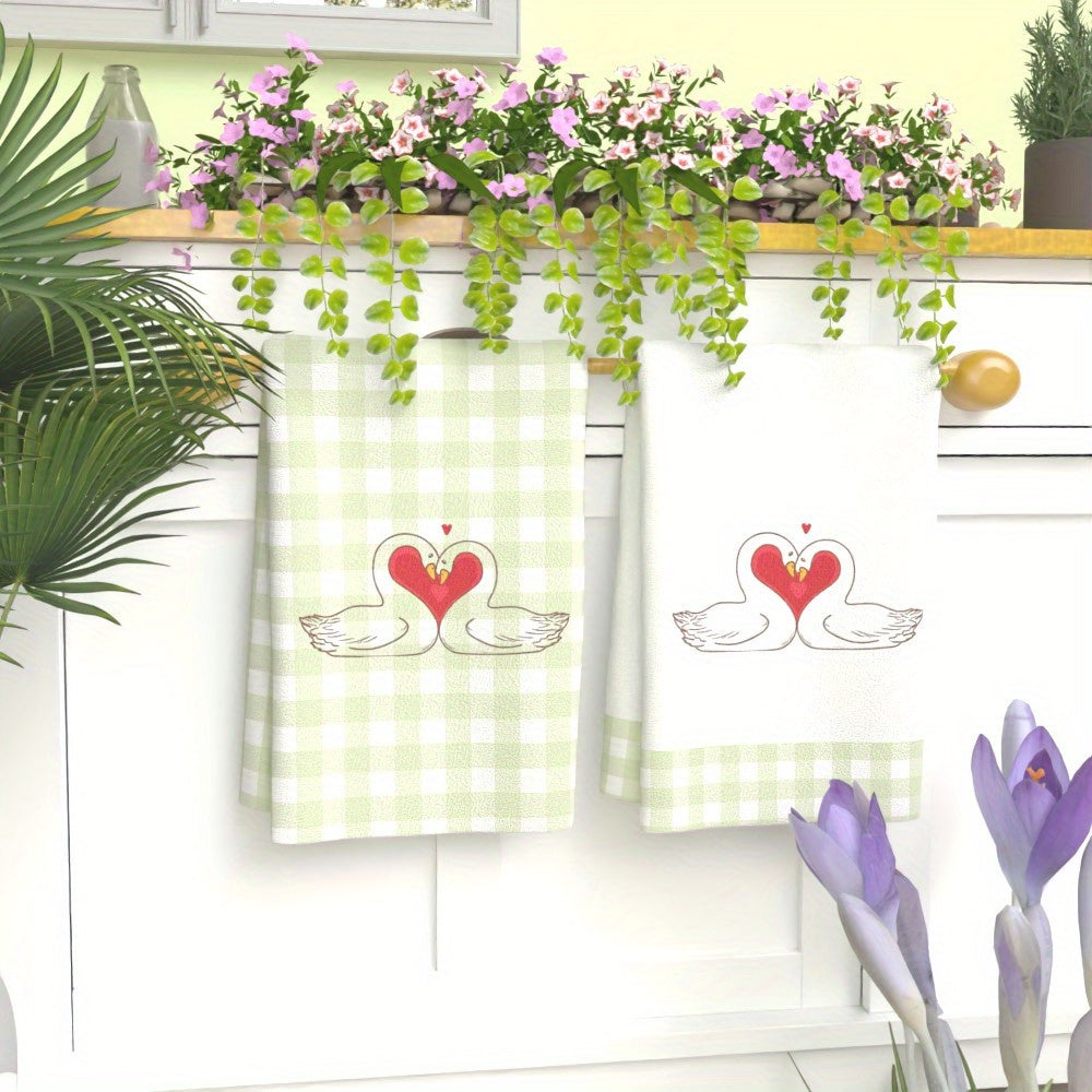 Two pieces of Valentine's Day kitchen towels made of soft, quick-dry polyester material measuring 45.72x66.04cm. Featuring a lovely heart and swans design in vibrant colors, these towels are perfect for use in the home, parties, and outdoor settings.