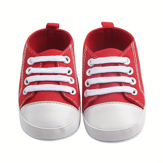 Soft, durable red canvas sneakers for baby boys. Ideal for indoor and outdoor walking in spring and autumn.