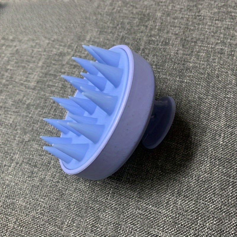 Silicone scalp massager with gentle exfoliating shampoo comb. No batteries needed, comes in 3 colors.