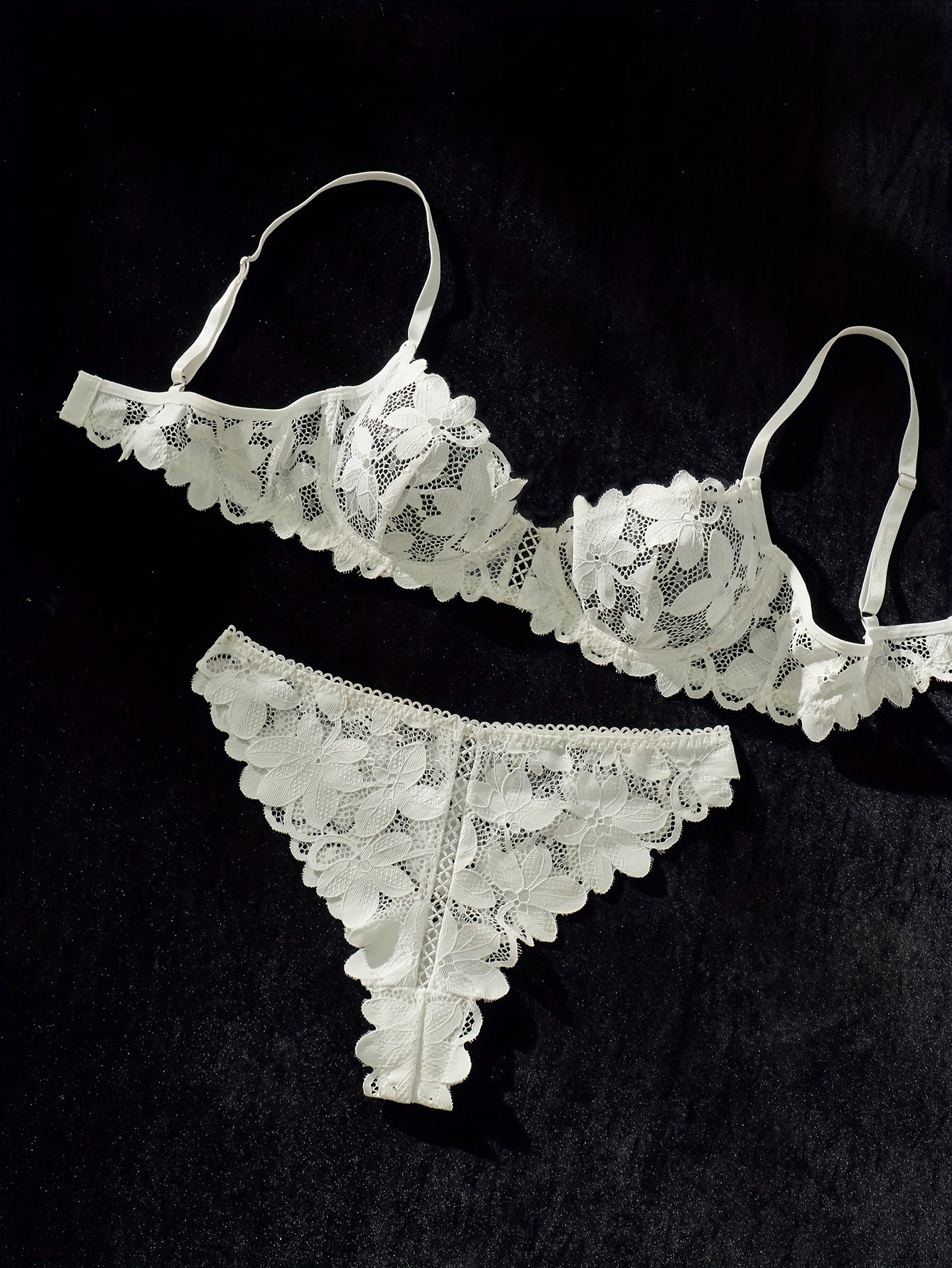 Sexy lace lingerie set with flower pattern, spaghetti straps, and matching bra and panty.