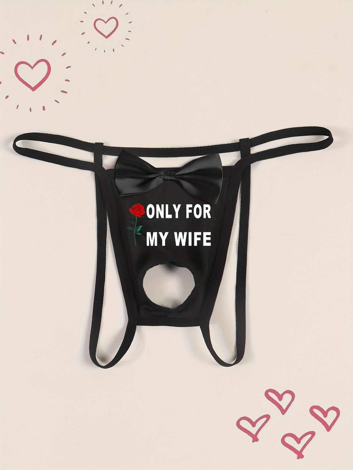 Men's sexy black thong with front cut-out and bow detail, featuring "ONLY FOR MY WIFE" red rose print. Made with comfortable, breathable polyamide (90%) and elastane (10%) knit fabric.