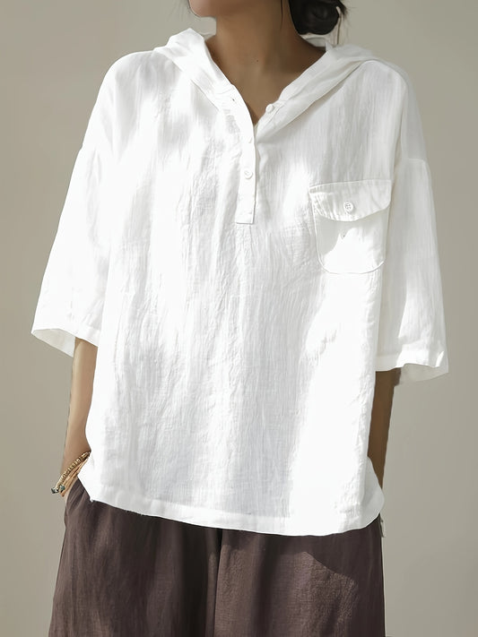 Loose-fitting short-sleeve top with hood and button closure.