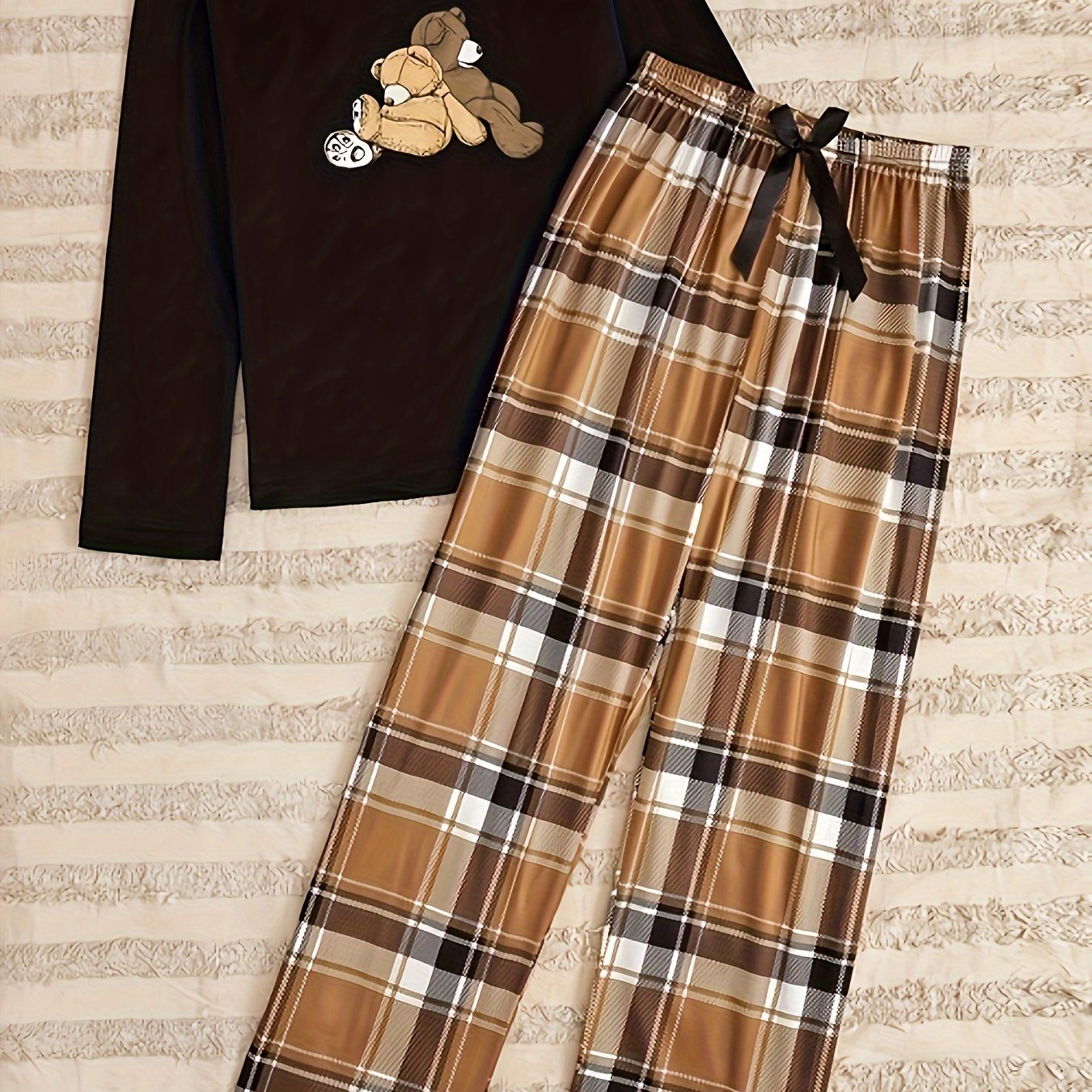 Women's cozy bear print lounge set with long-sleeve top and plaid pants for relaxed fall wear.