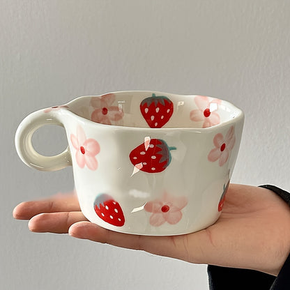 Unique hand-painted ceramic mug with a charming strawberry and floral design, perfect for coffee or tea. Ideal Valentine's Day gift, reusable and high-quality, featuring an irregular art style.