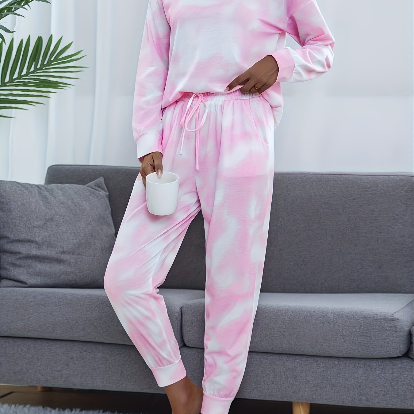 Tie dye lounge set for women, with long sleeve top and elastic waistband pants.