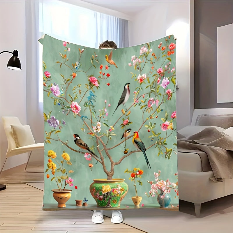 Soft, Portable Green Floral & Bird Print Fleece Blanket. This tear-resistant and stain-proof blanket is made from 100% polyester, offering all-season comfort. Perfect for home decor and travel, it is also machine washable for easy care.