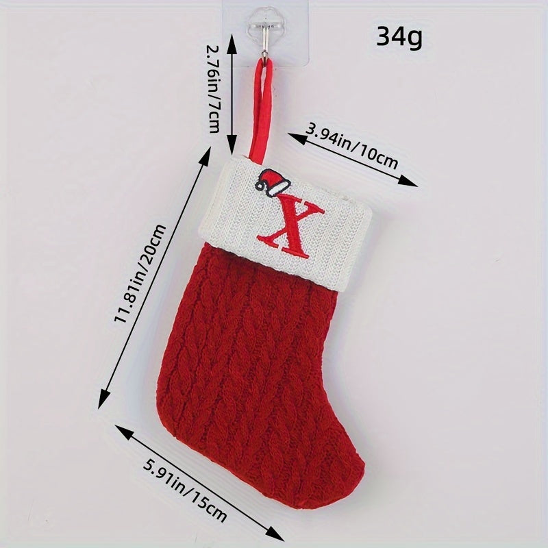 Knitted letter Christmas socks for home tree ornaments; red socks in gift bag for festive attire.