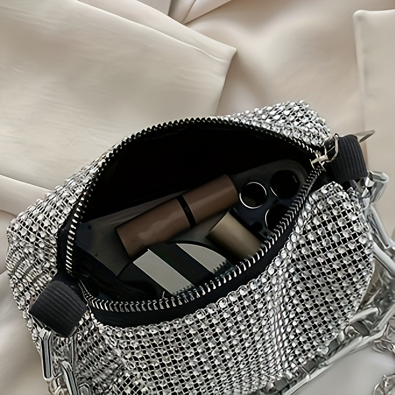 Metallic evening bag with chain strap, zip closure, and polyester lining in silver grey - a stylish accessory for women.