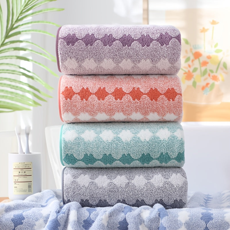 One set of extra large and small bath towels for women made of super soft, absorbent coral velvet with a modern design and strong absorbency.