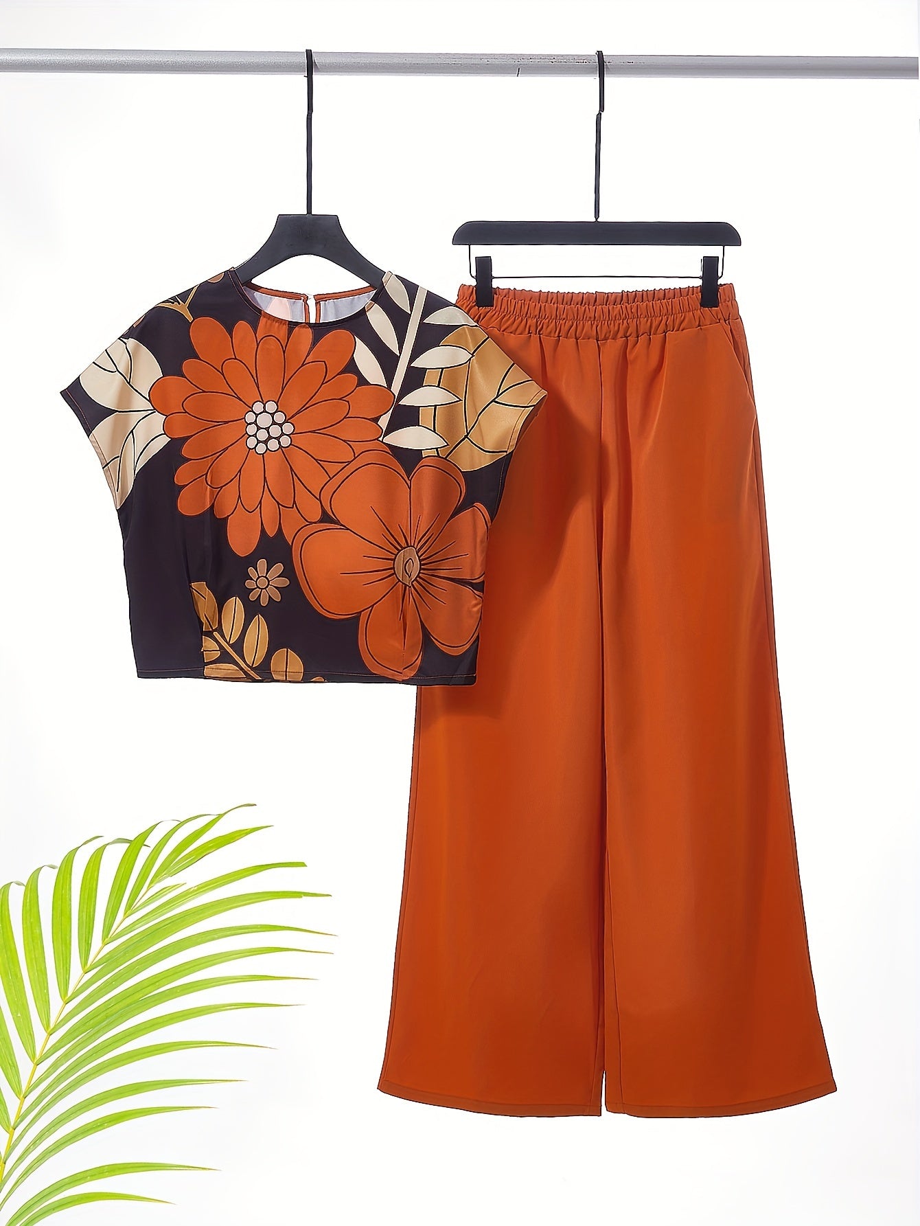 Women's two-piece set featuring a crew neck top and wide-leg pants, machine washable, part of the Spring/Summer Collection.