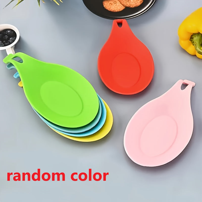 Silicone spoon rest for kitchen utensils - Easy to clean, heat-resistant holder for spoons and seasonings.