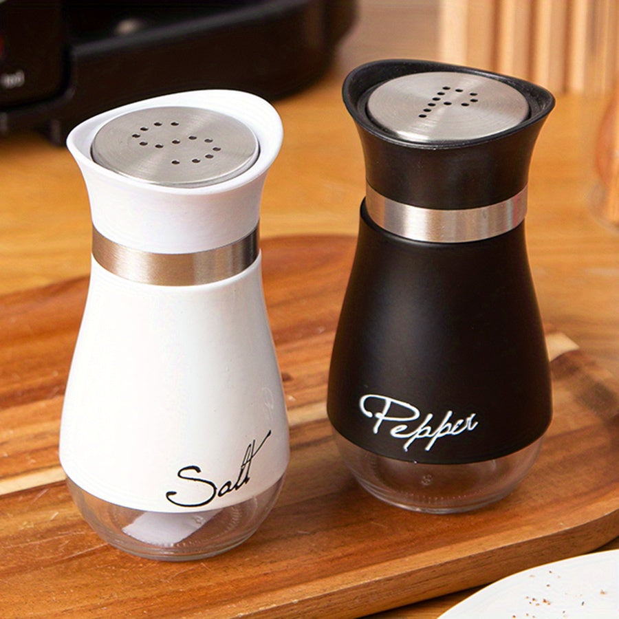 Set of two 3.4oz salt and pepper shakers for kitchen use.