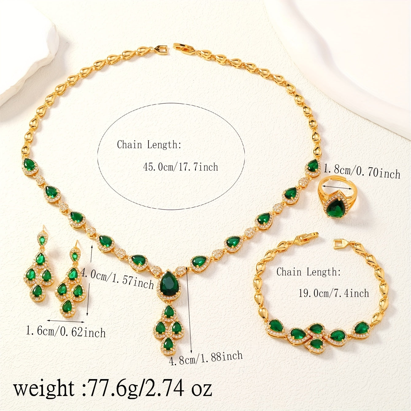 A set of four pieces of stunning Middle Eastern women's wedding jewelry from Saudi Arabia, featuring full inlay peacock green water drop-shaped cubic zirconia on copper. The set includes one necklace, one bracelet, one ring, and one pair of earrings.