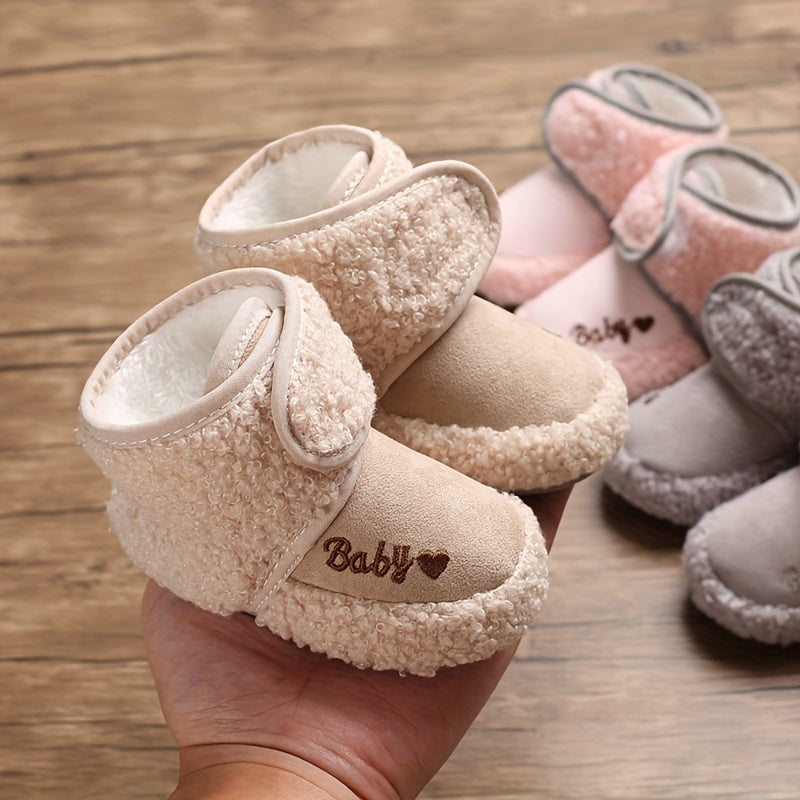 Cozy boots for baby boys and girls, featuring hook and loop fasteners for indoor and outdoor winter walks.