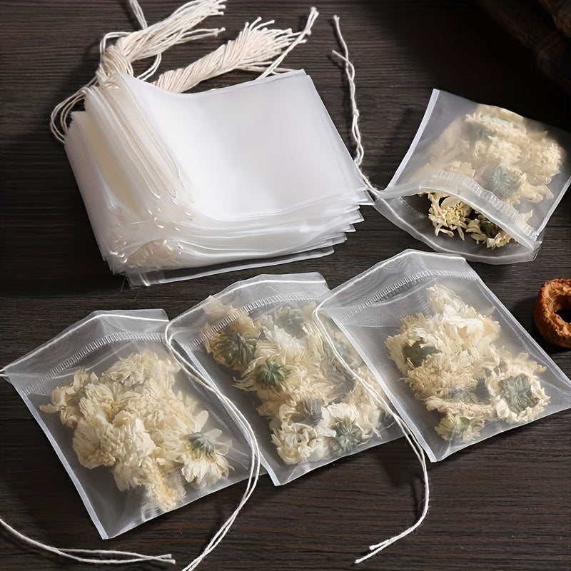 100 pieces of high-quality disposable tea and coffee filter bags with a convenient drawstring closure - ideal for brewing loose leaf tea, aromatic teas, and spices.