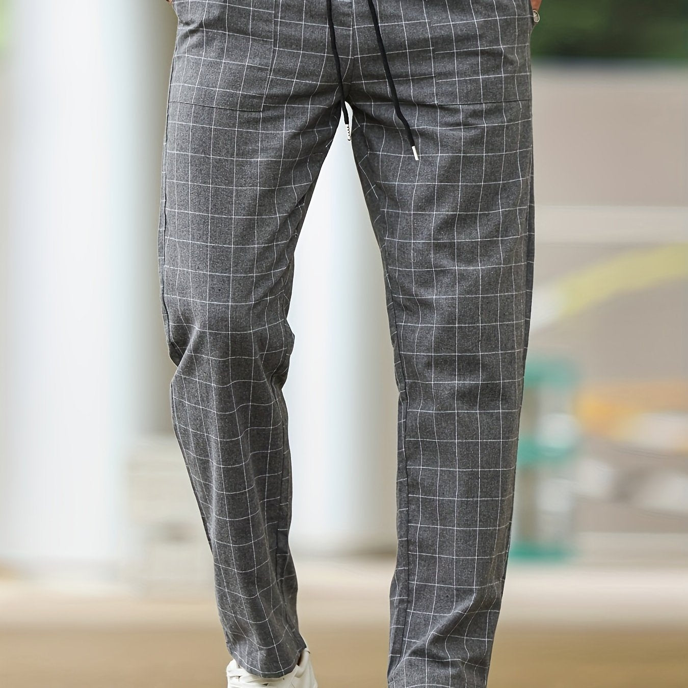 Men's polyester pants with drawstring waist, ideal for spring and fall, featuring casual striped plaid pattern.