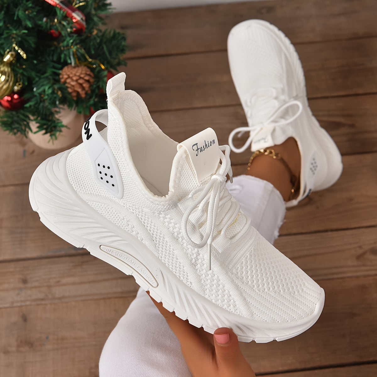 Trendy white knit fabric sneakers for women with EVA sole and breathable lace-up design, suitable for all seasons. Lightweight and stylish.