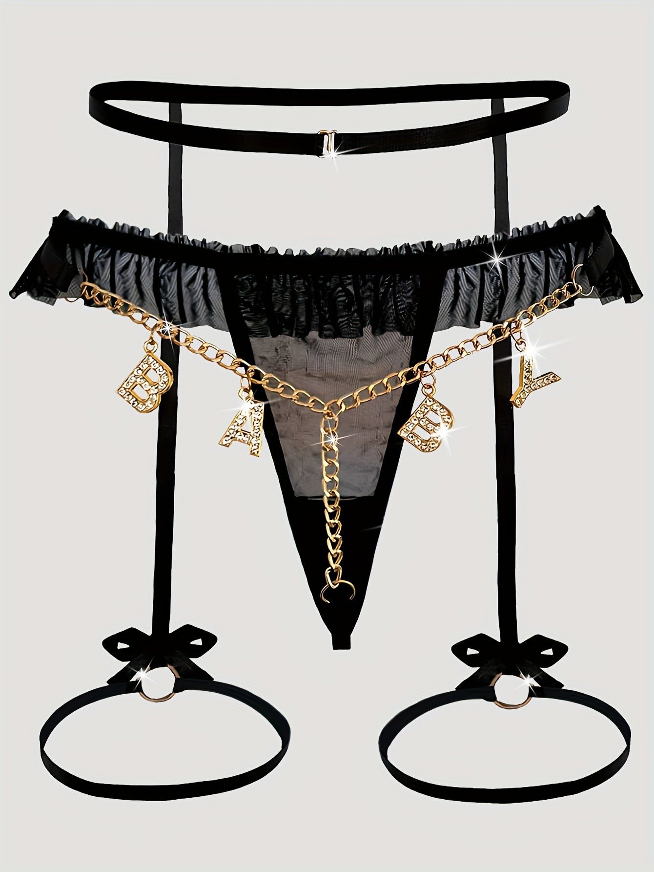 Seductive mesh garter set with gold chain, bow, and letter T-back.