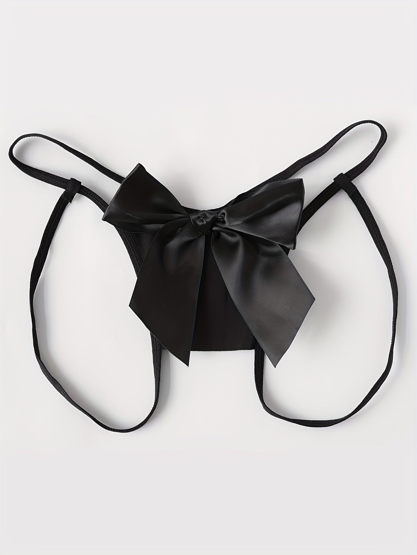 Patterned bow thong with open crotch, low waist.