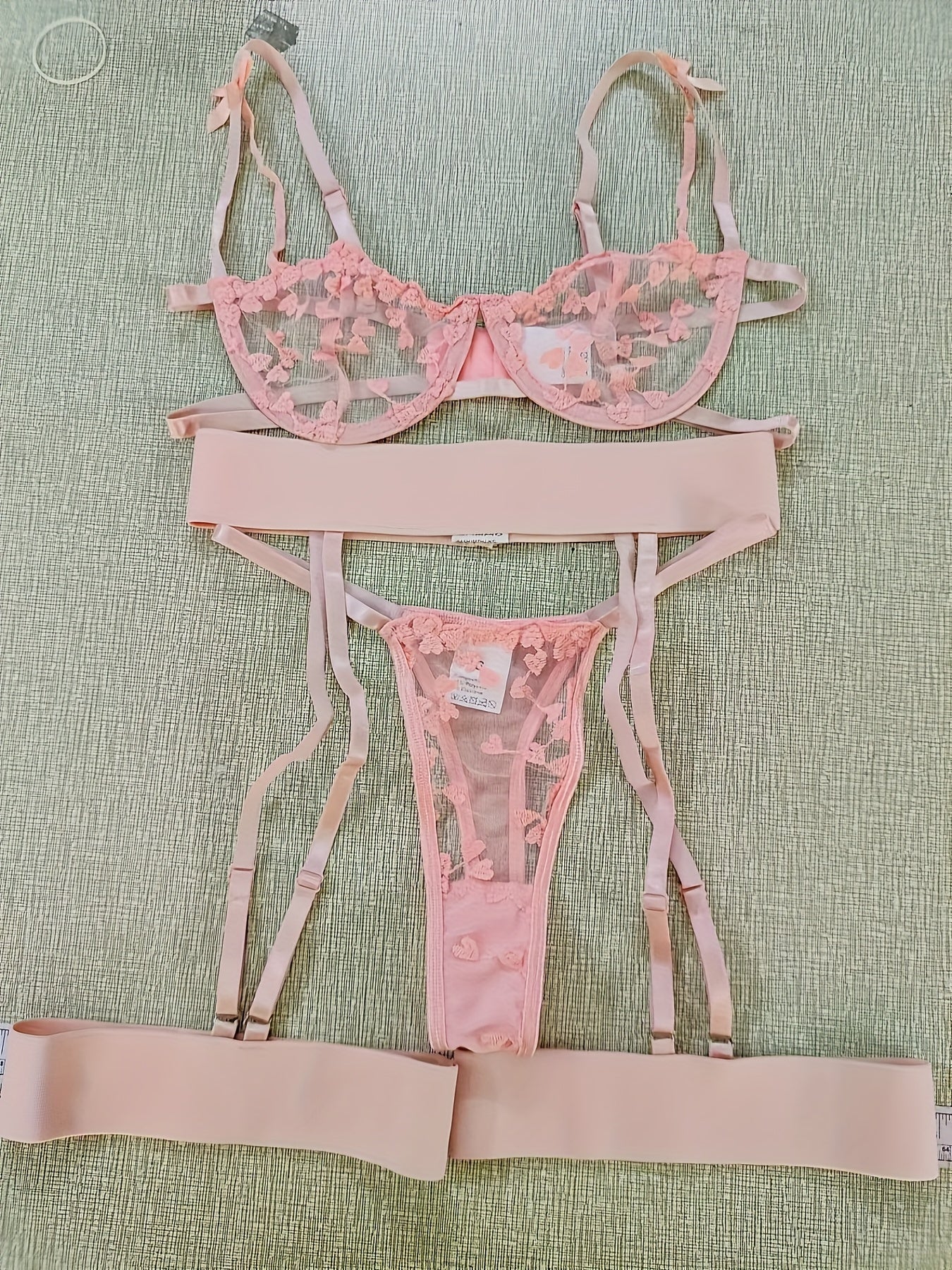 Youthful and flirty lingerie set with sheer lace embroidery.