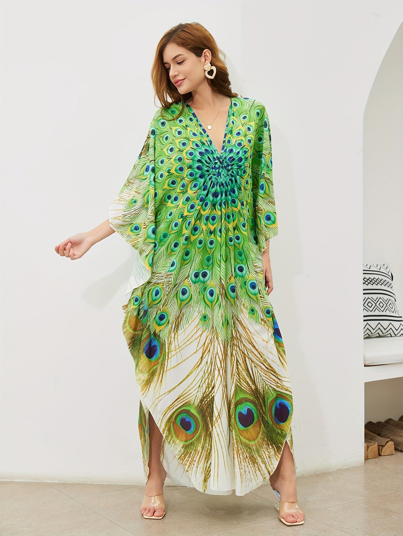 Handmade V-neck maxi beach dress in vibrant green, yellow, and blue peacock print, perfect cover-up for swimwear.