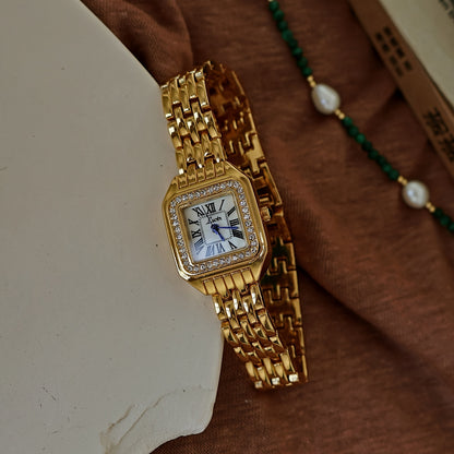 Gold-toned square watch with water drops and Roman numerals, suitable for any occasion.