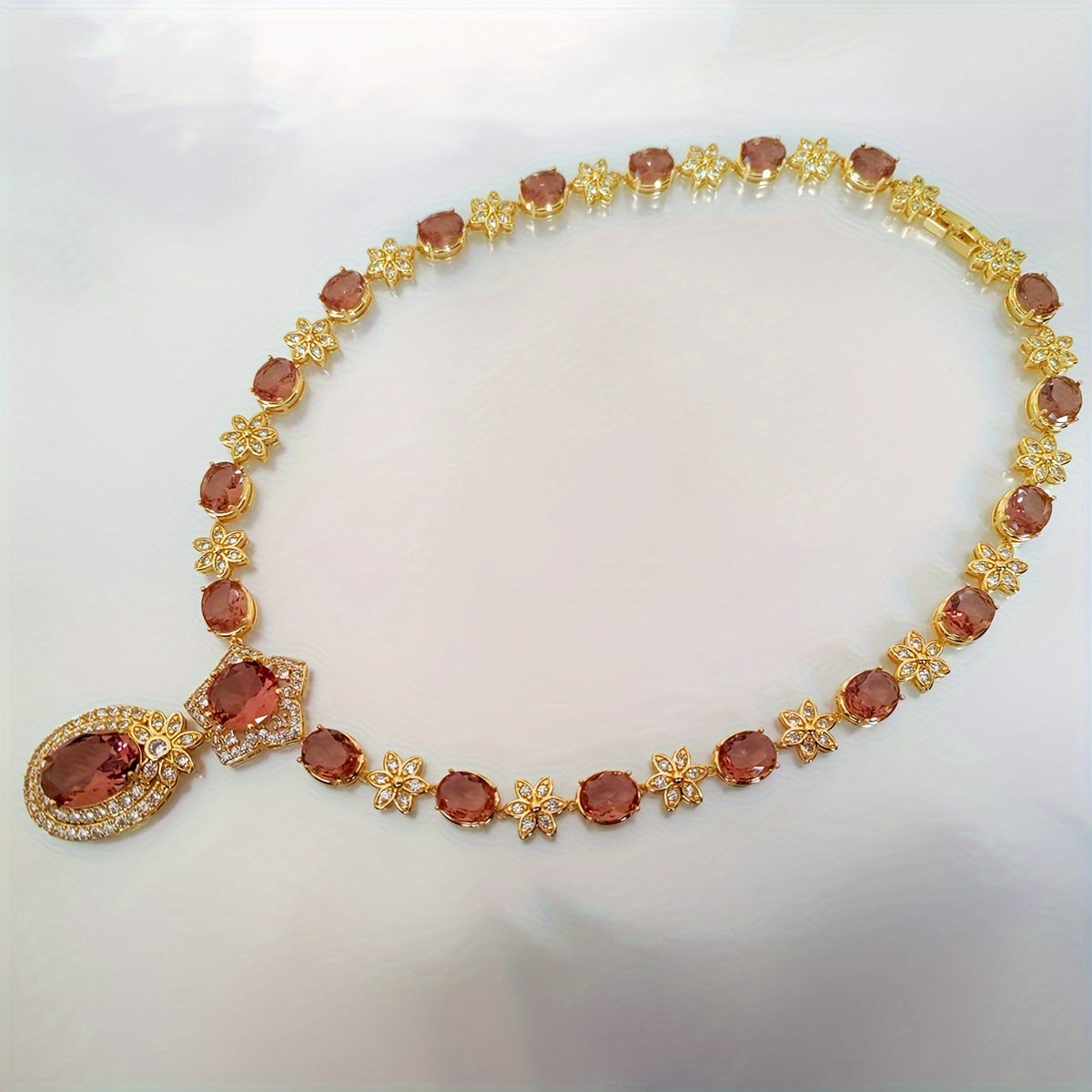 Introducing the MEETMAY Synthetic Color Changing Sultanite Diaspore Oval Sunflower Jewelry Set. This elegant copper-tone four-piece set includes a ring, earrings, bracelet, and necklace. The colors are customizable to adapt to different lighting