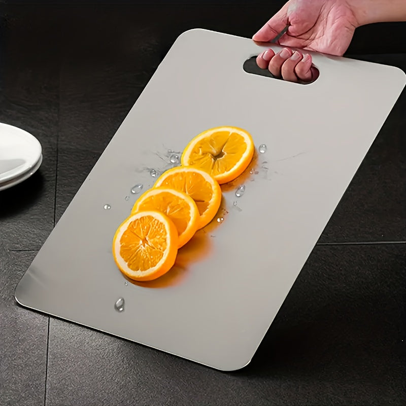 1 piece of a chopping board made of 304 stainless steel, suitable for cutting fruits, vegetables, and meat. It is ideal for use in home kitchens, camping, and offers portability and convenience. A must-have in your kitchen as a gadget and accessory.