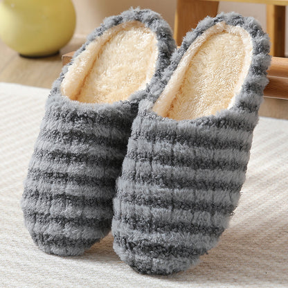 Women's striped print plush house slippers with anti-slip sole for indoor use.