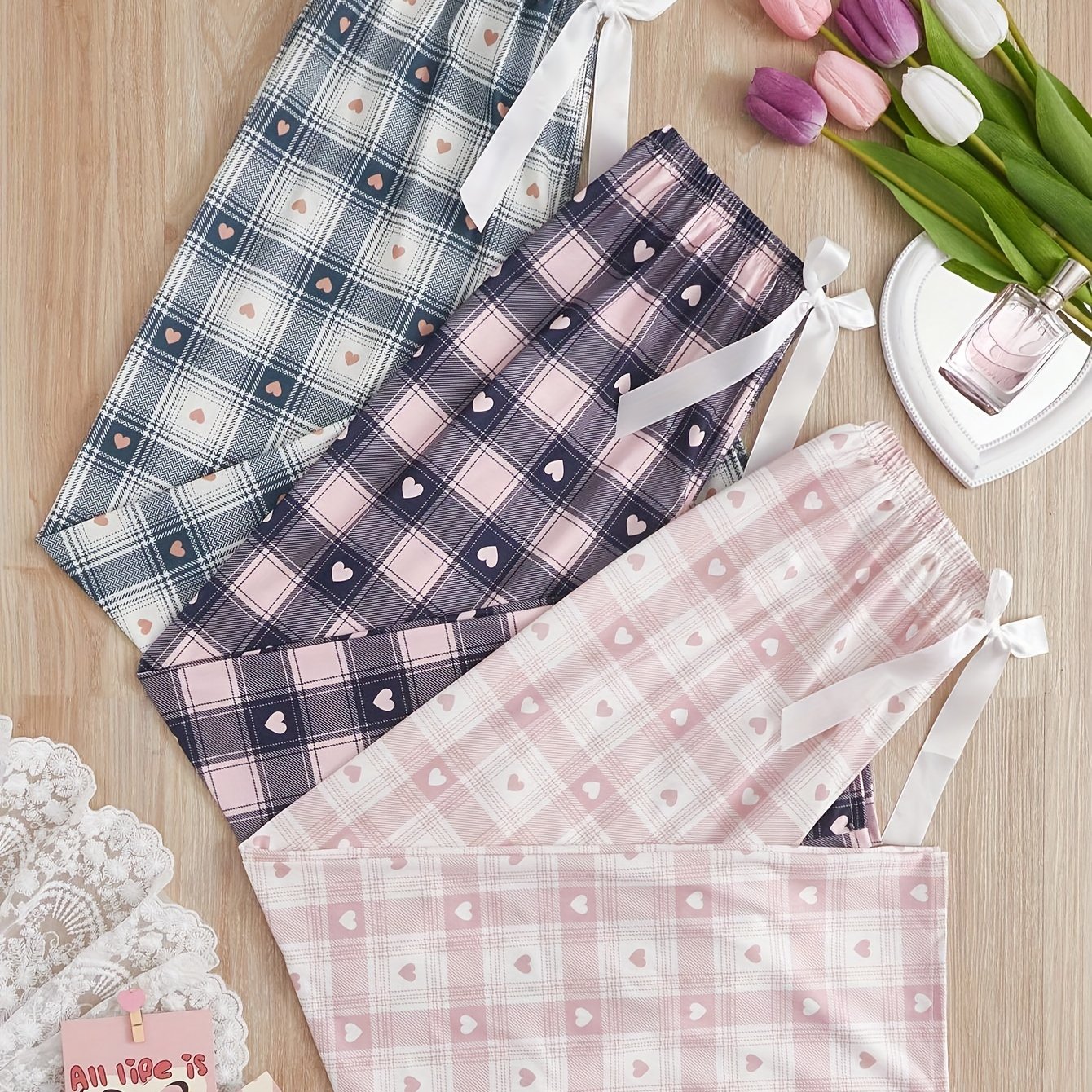 New arrival 3-pack women's printed plaid sleep pants for all seasons. Made of polyester with a front tie bow detail, perfect for summer and autumn home wear. Adult size, no belt included.