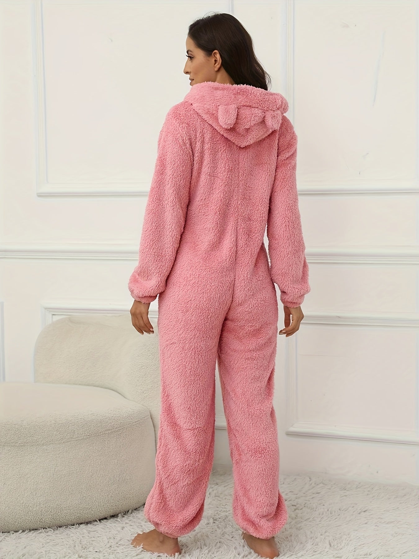 Hooded lounge jumpsuit with fuzzy fabric, zippered front, perfect for women's loungewear and sleepwear.