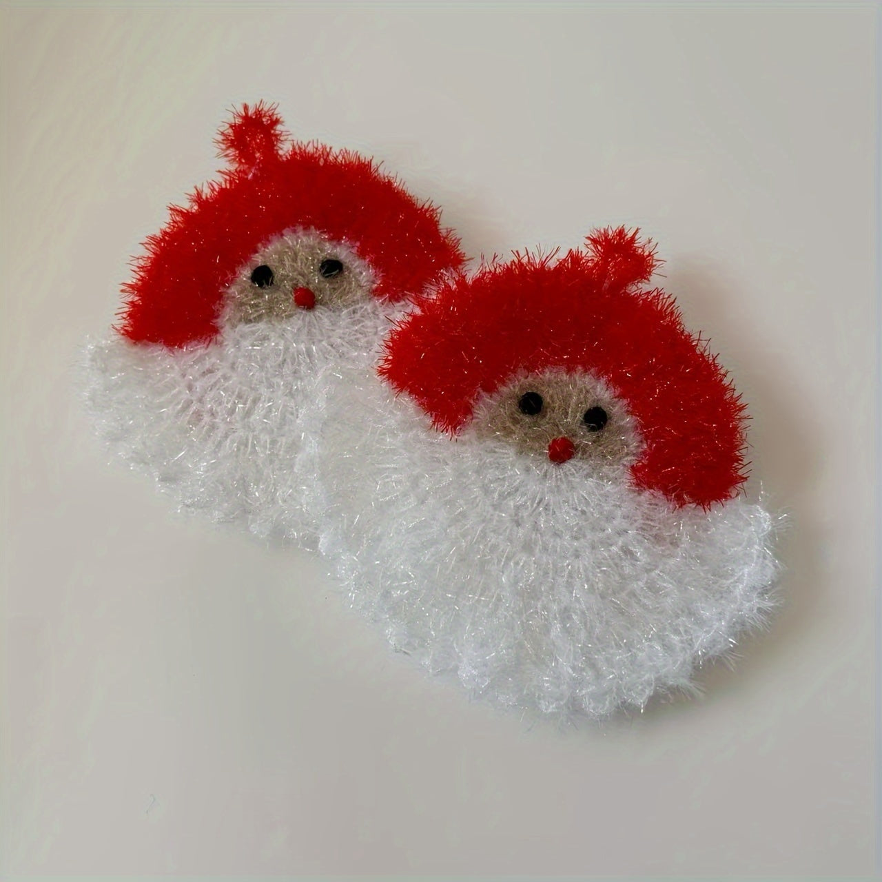 Handcrafted crochet Santa Claus dish towel is perfect for kitchen and bathroom use. This multifunctional scouring pad is made from anti-pill polyester blend. Ideal for Christmas, Halloween, or as a gift. Factory direct.