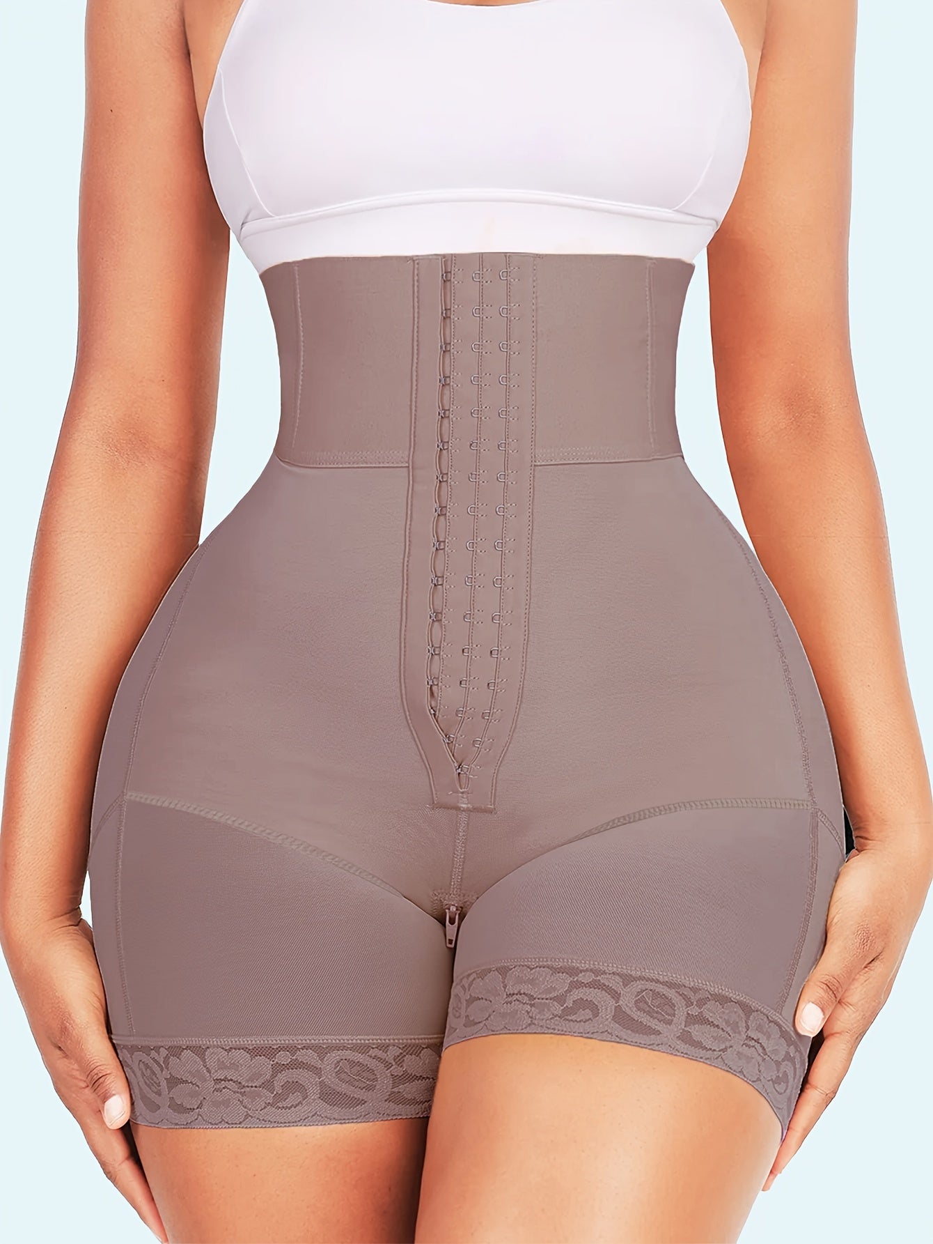 Compression tummy control panties with high waist and butt lifter for shaping the body.