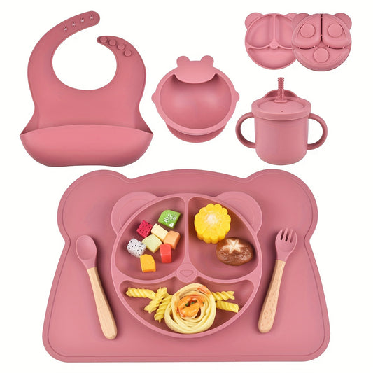 7-piece toddler meal set with silicone utensils in mixed colors, featuring cartoon design and high suction power. Easy to clean and includes placemat, plate, bowl, spoon, fork, bib, and