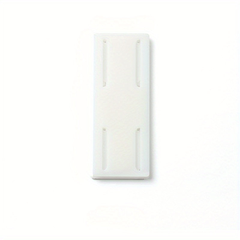 Wall-mounted storage for sockets with adhesive backing, suitable for various rooms and spaces such as living rooms, bedrooms, offices, bookshelves, and storage boxes. This socket holder requires no punching and leaves no trace when removed.