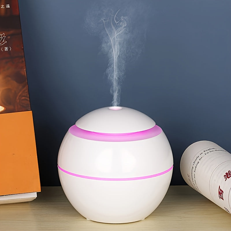 Quiet USB-powered cold mist humidifier and essential oil diffuser, ideal for bedroom, office, living room, and travel during winter and autumn. Portable and easy to clean.