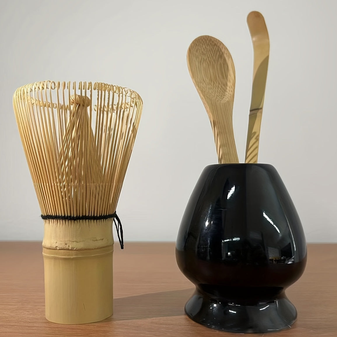 A set of 4 Japanese Matcha Ritual Accessories, including a Momonri Traditional Spoon, Tea Spoon, Matcha Egg Beater, and other accessories. This perfect set is ideal for preparing traditional Matcha. The set features a natural bamboo tea egg beater in