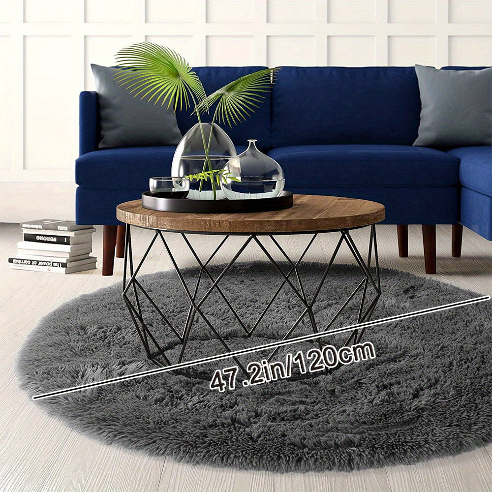 Soft shaggy round rug made of 100% grey polyester. This fluffy area rug is machine washable, fade resistant, and features a low pile tufted weave with PVC backing. Perfect for bedroom, nursery, and kids room decor. Great for gifts on Christmas