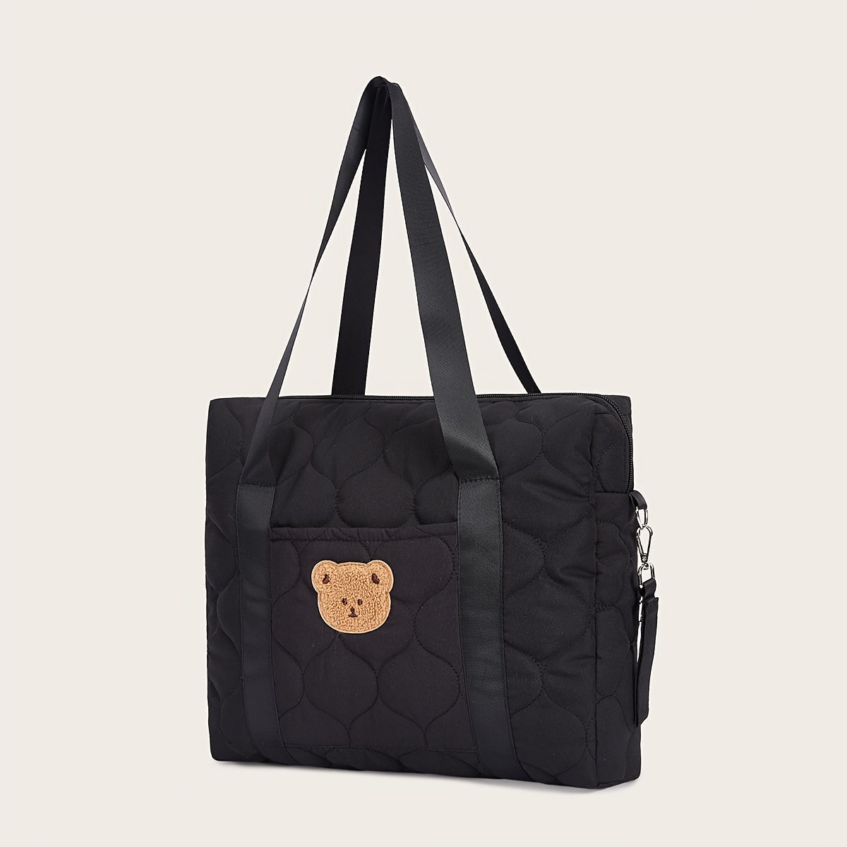 Large black parent bag with ample storage space, perfect for taking on the go. Features a shoulder strap for easy carrying.