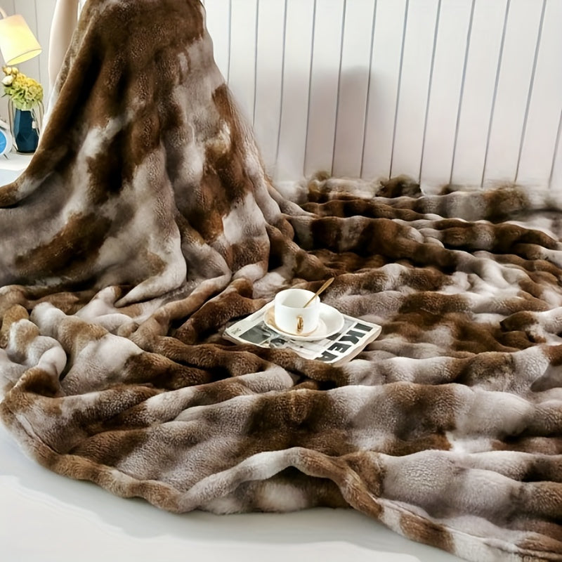 Soft and plush faux fur throw blanket for ultimate luxury and comfort. Perfect for cozying up on the couch or adding a touch of elegance to your bedroom or living room. Machine washable for easy care, suitable for all seasons. Measures 99.06x149.86cm.